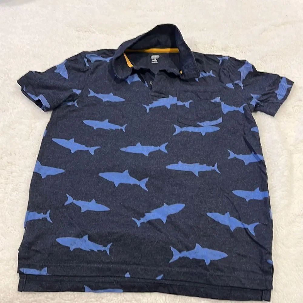 Old navy blue polo shirt with sharks size 10–12